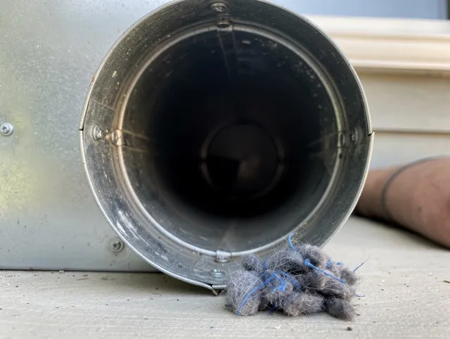Ledyard Dryer Vent Cleaning technician using specialized equipment to clear severe dryer vent blockage in Ledyard